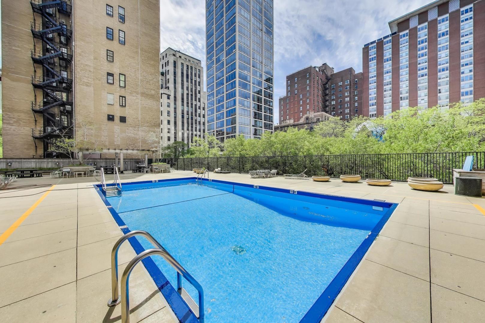 1310 North Ritchie Court, Unit 9D Chicago, IL 60610 - Photo 24 of 27 a view of swimming pool from a balcony