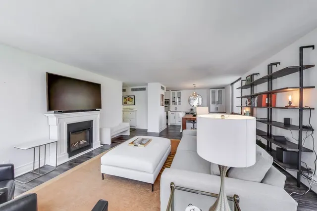 a living room with a flat screen tv and a fireplace