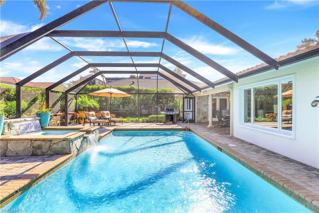 a view of swimming pool with seating area