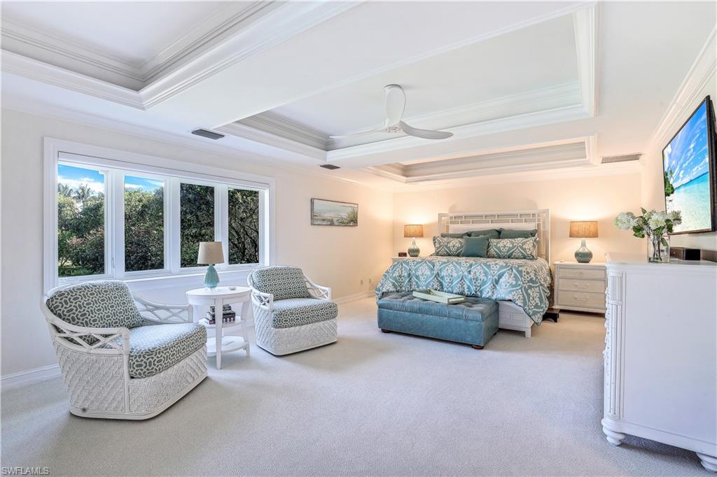 635 Anchor Rode Drive Naples, FL 34103 - Photo 22 of 50 a living room with furniture and a large window