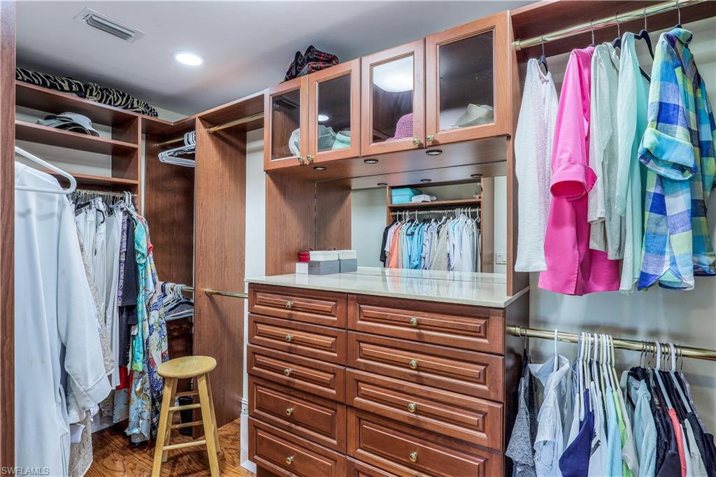 635 Anchor Rode Drive Naples, FL 34103 - Photo 24 of 50 a view of walk in closet with clothes and shoes