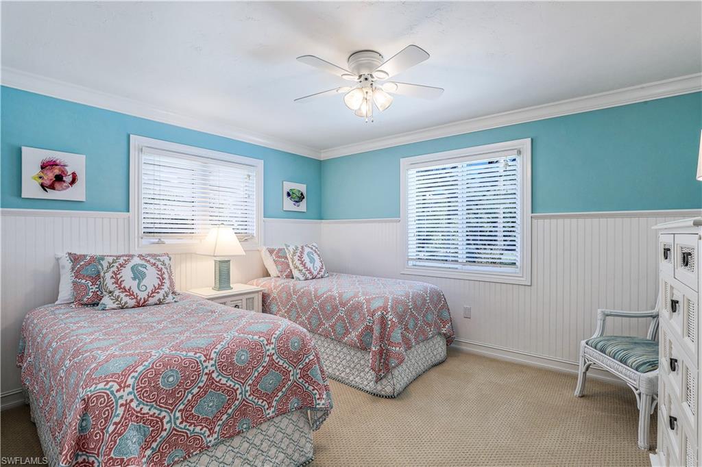 635 Anchor Rode Drive Naples, FL 34103 - Photo 27 of 50 a bedroom with two beds and a window