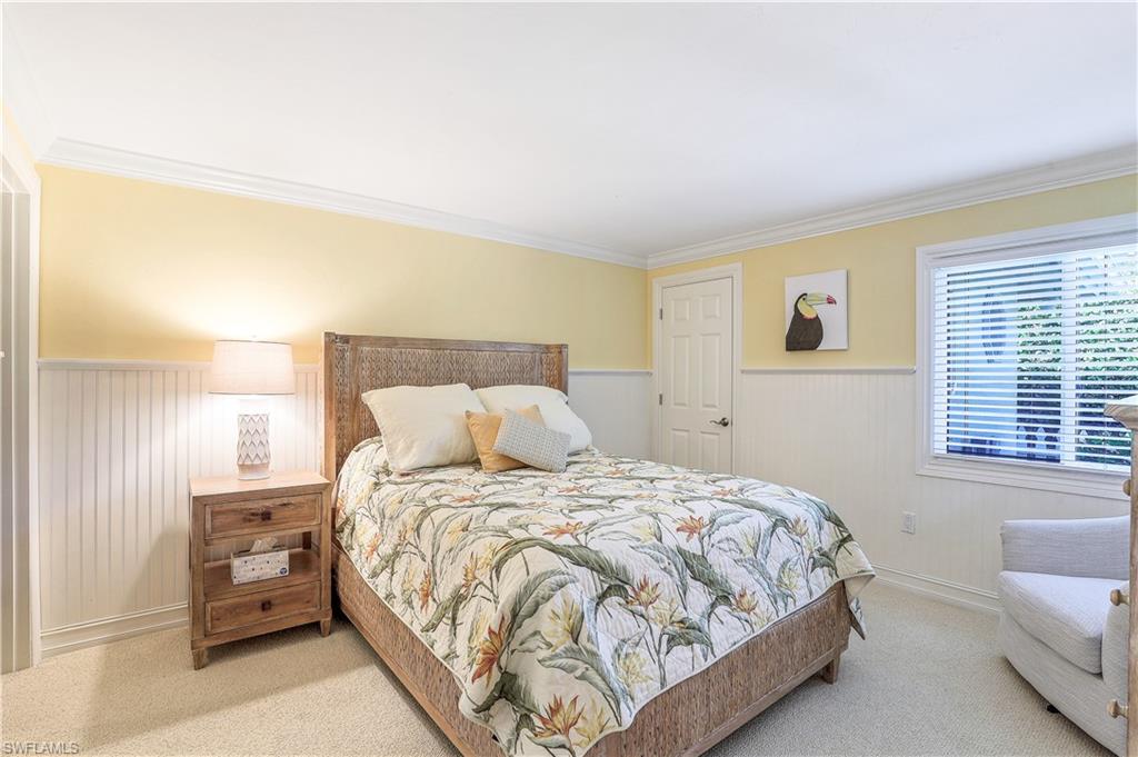 635 Anchor Rode Drive Naples, FL 34103 - Photo 31 of 50 a bedroom with a bed and a couch