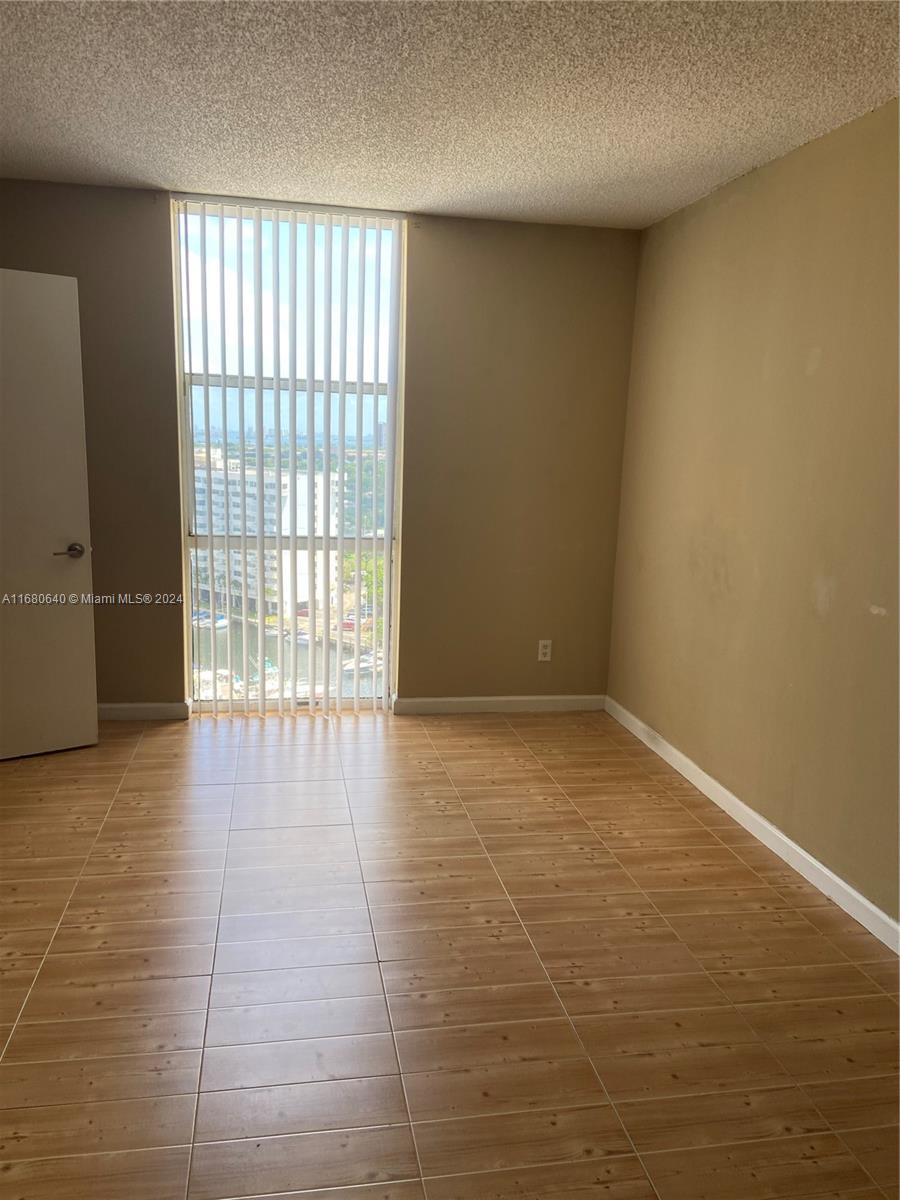 13499 Biscayne Boulevard, Unit 1506 North Miami, FL 33181 - Photo 11 of 11 a view of an empty room with a window