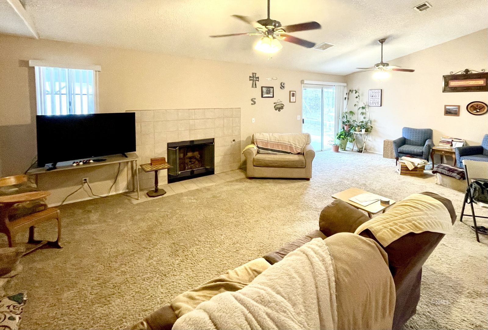 529 South Allen Street Ridgecrest, CA 93555 - Photo 7 of 17 a living room with furniture and a flat screen tv