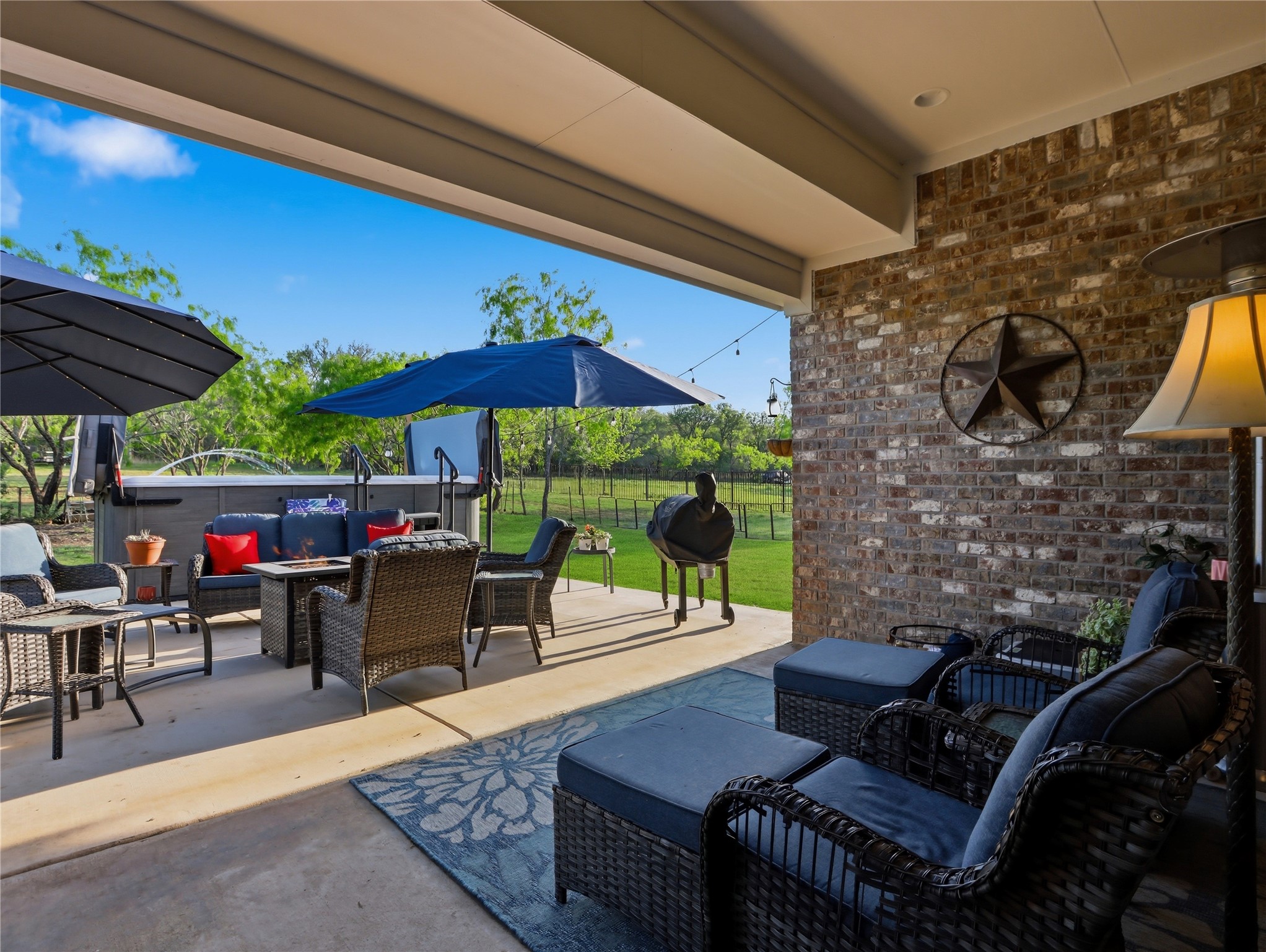 316 Raptor Beak Way Cedar Creek, TX 78612 - Photo 9 of 30 a outdoor living space with patio furniture and a fireplace
