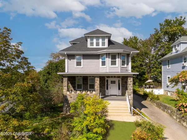 front view of a house with a yard