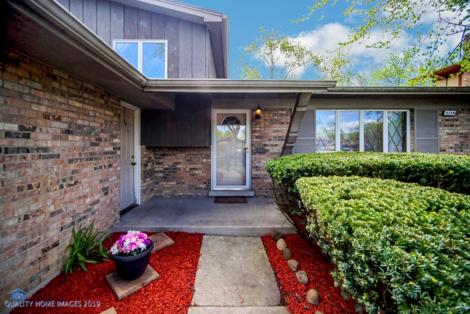5119 Riverside Drive Richton Park, IL 60471 - Photo 2 of 26 a front view of a house with a garden