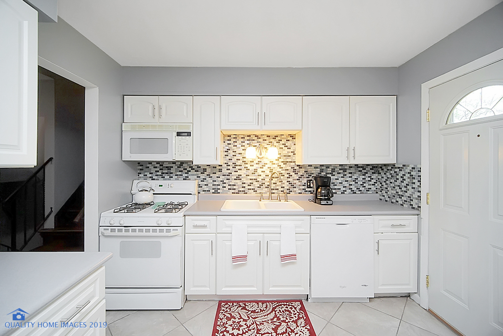 5119 Riverside Drive Richton Park, IL 60471 - Photo 13 of 26 a kitchen with white cabinets sink and white appliances