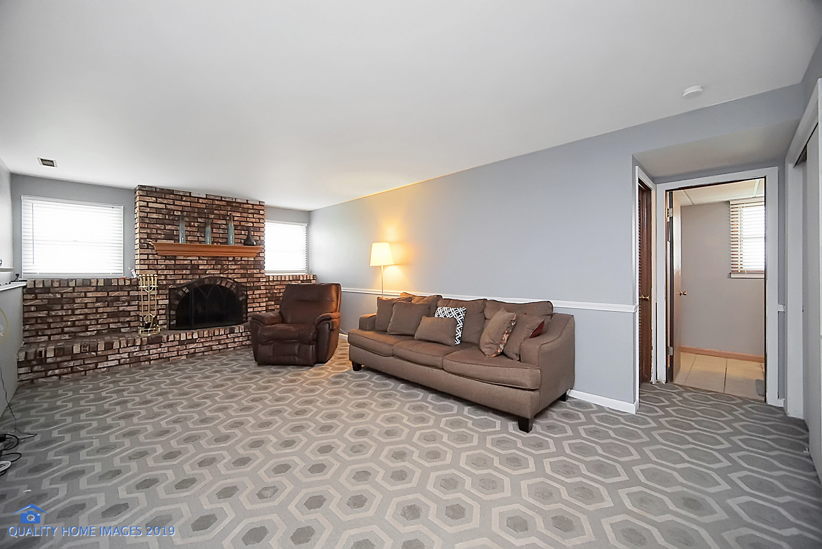 5119 Riverside Drive Richton Park, IL 60471 - Photo 14 of 26 a living room with furniture a fireplace and a flat screen tv