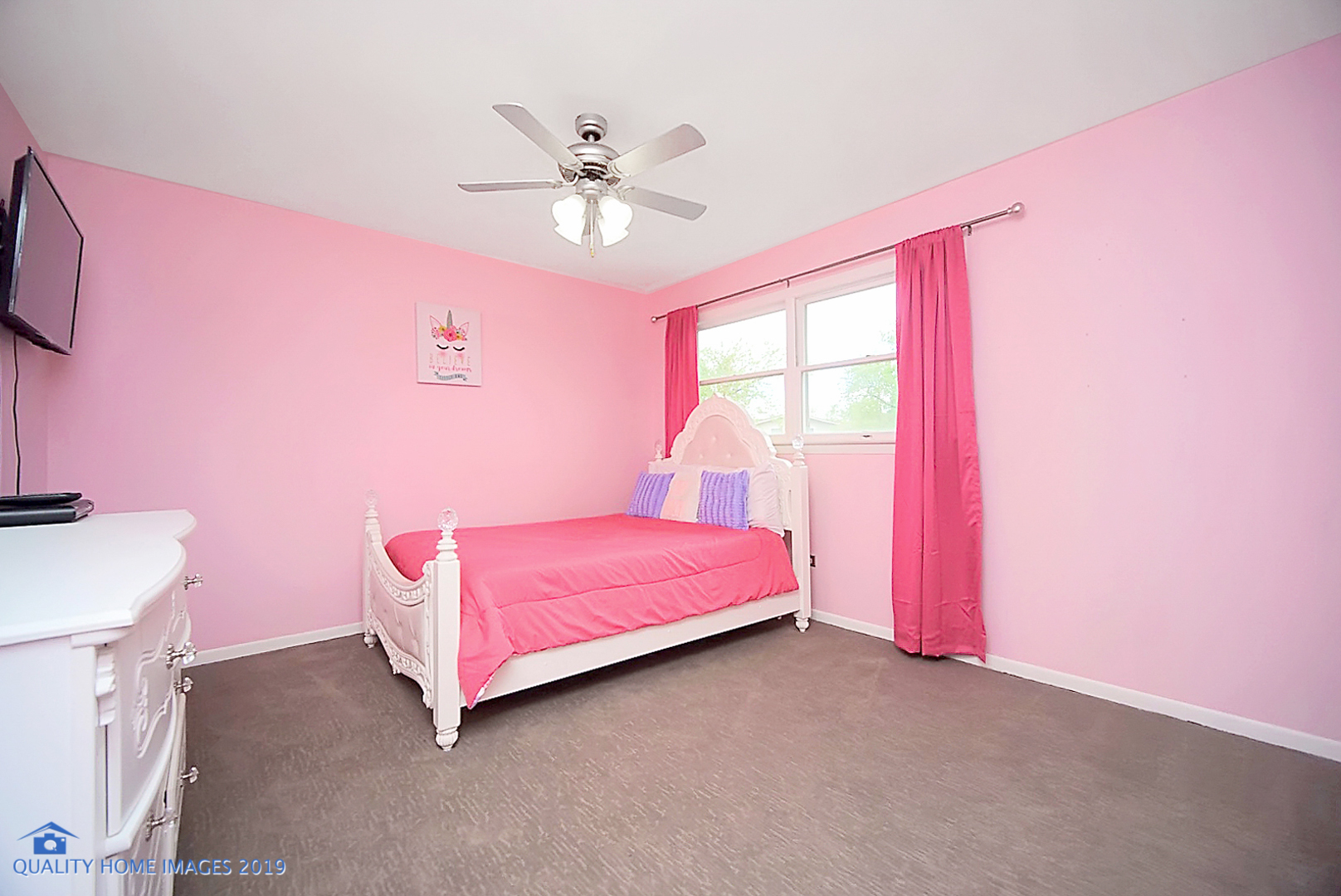 5119 Riverside Drive Richton Park, IL 60471 - Photo 19 of 26 a spacious bedroom with a bed and a chandelier