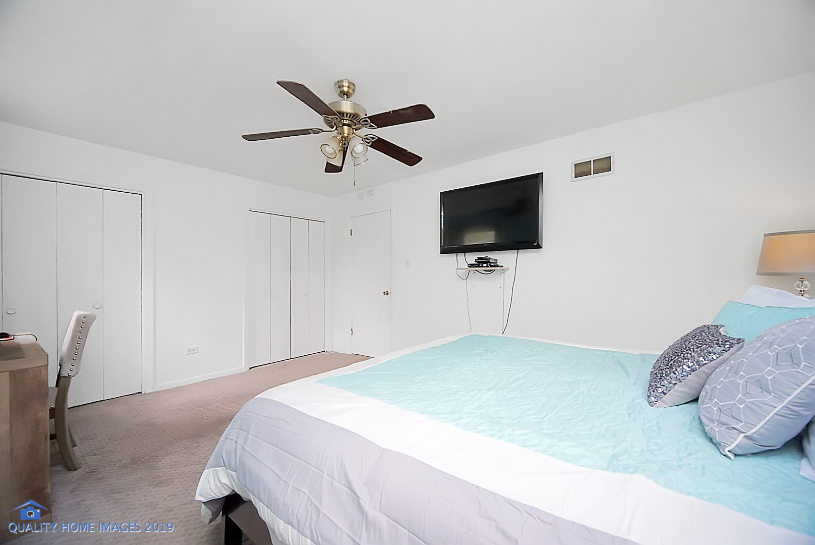 5119 Riverside Drive Richton Park, IL 60471 - Photo 21 of 26 a bedroom with a bed and a flat screen tv