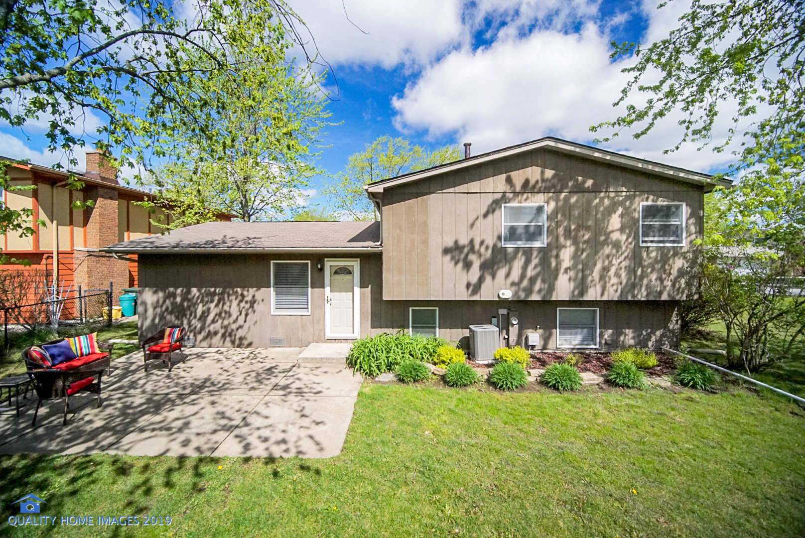 5119 Riverside Drive Richton Park, IL 60471 - Photo 25 of 26 a front view of a house with a garden