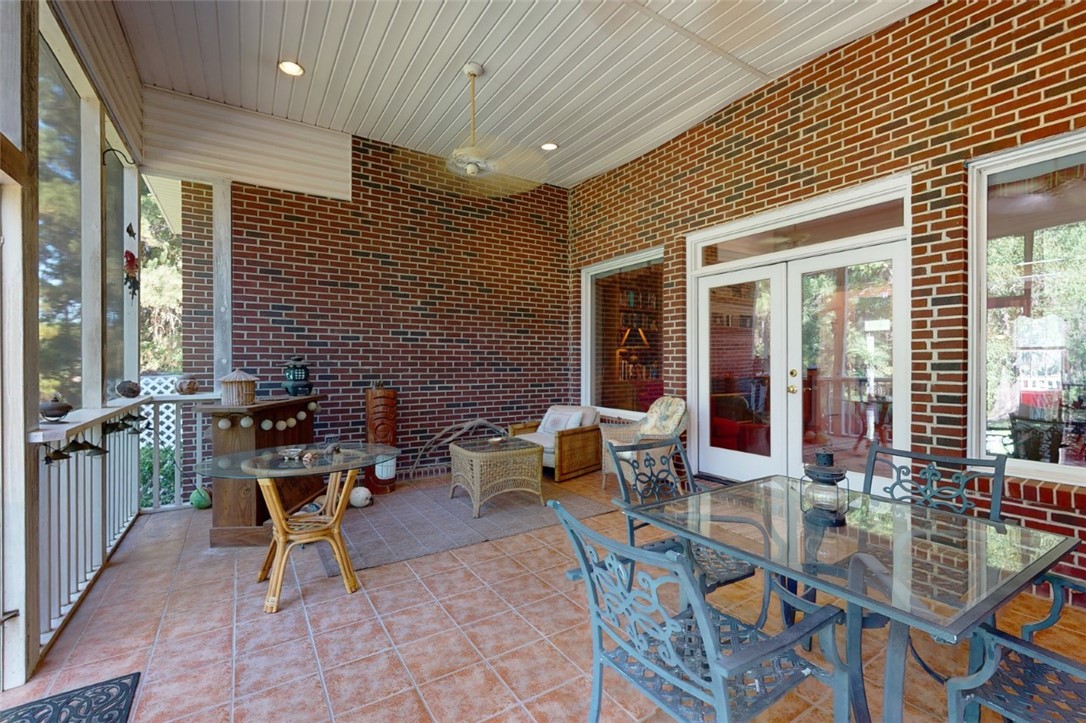 113 Mariners Walk Brunswick, GA 31523 - Photo 11 of 39 Large screened in porch off of great room