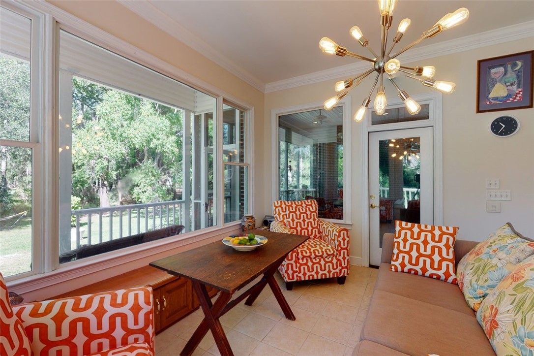 113 Mariners Walk Brunswick, GA 31523 - Photo 18 of 39 Breakfast area / sitting area views of backyard and screened porch