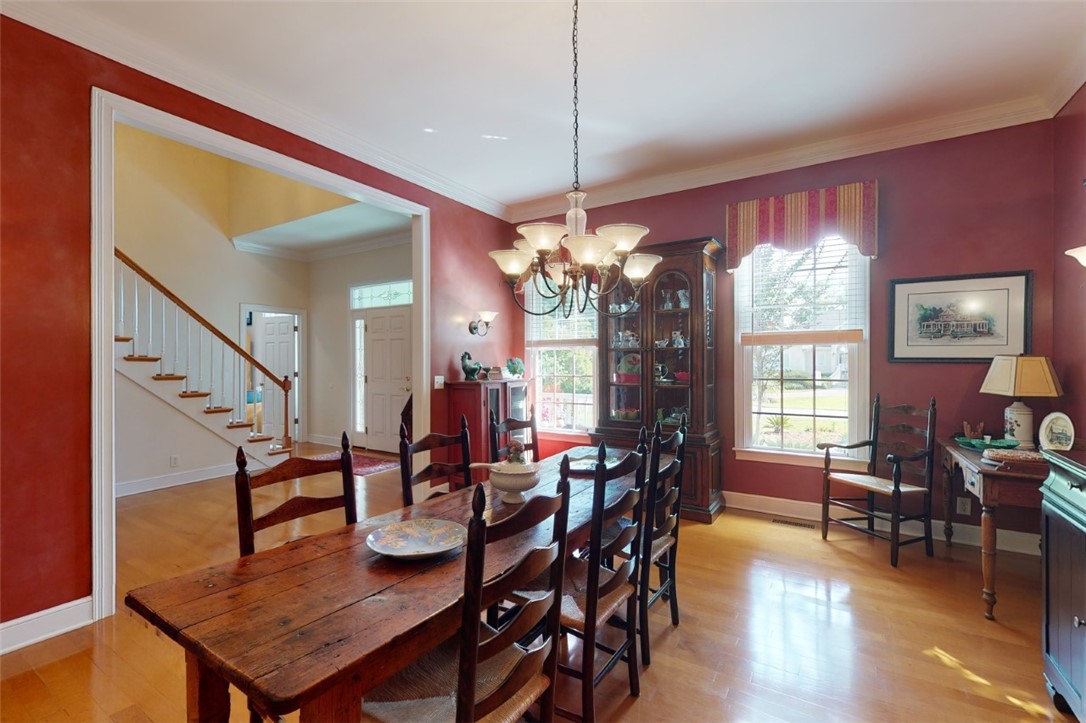 113 Mariners Walk Brunswick, GA 31523 - Photo 5 of 39 Formal dining room has crown molding and wall sconces