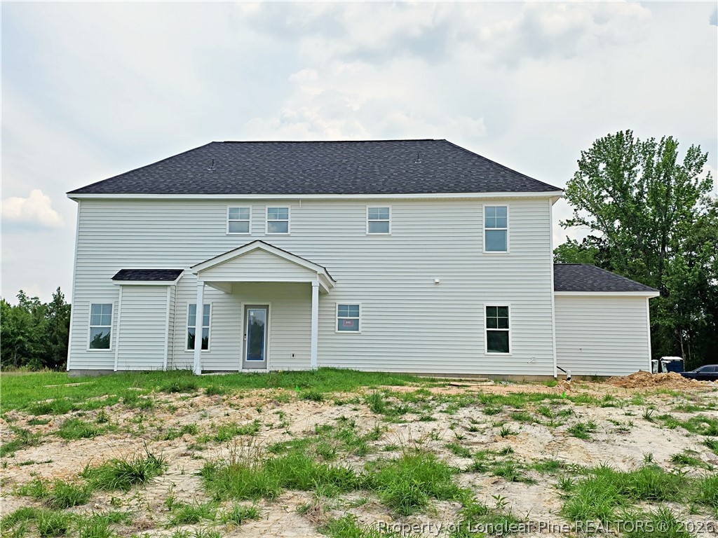 2650 Norrington Road Lillington, NC 27546 - Photo 21 of 24 a view of a house with a yard