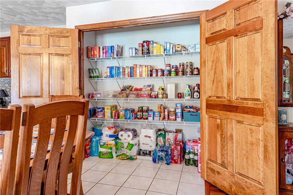612 Rembrandt Circle Irwin, PA 15642 - Photo 12 of 32 a cabinet with a book shelf
