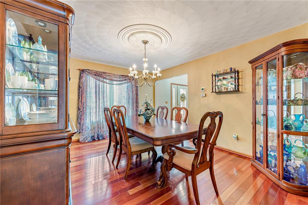 612 Rembrandt Circle Irwin, PA 15642 - Photo 13 of 32 a view of a dining room with furniture window and wooden floor