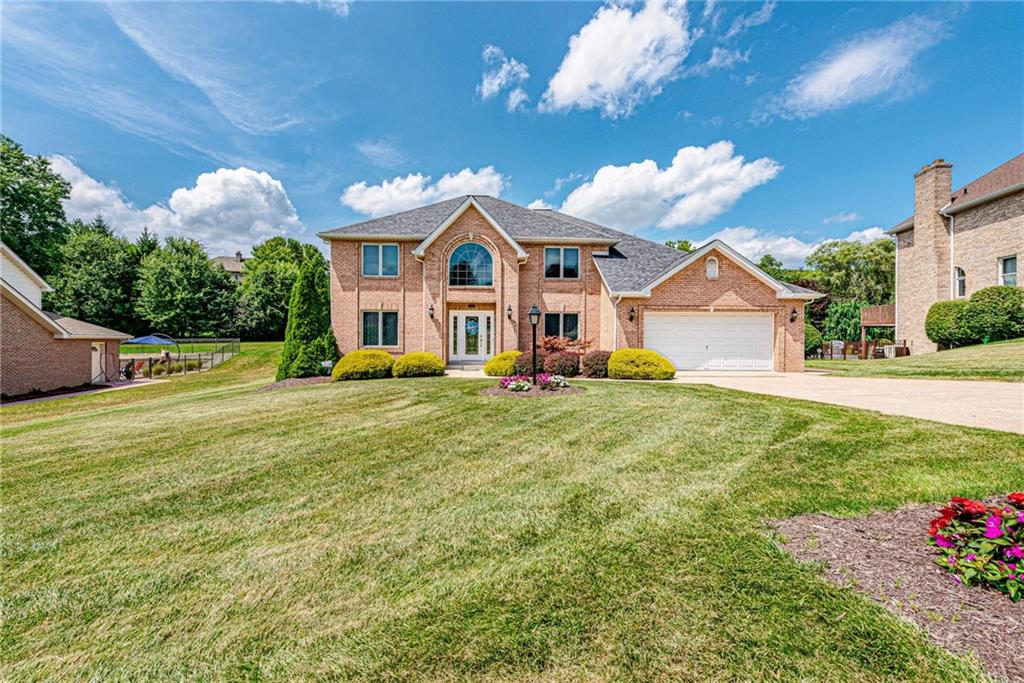 612 Rembrandt Circle Irwin, PA 15642 - Photo 2 of 32 a front view of a house with garden