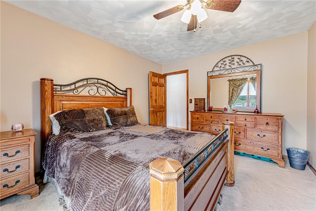 612 Rembrandt Circle Irwin, PA 15642 - Photo 22 of 32 a bedroom with a bed and a dresser