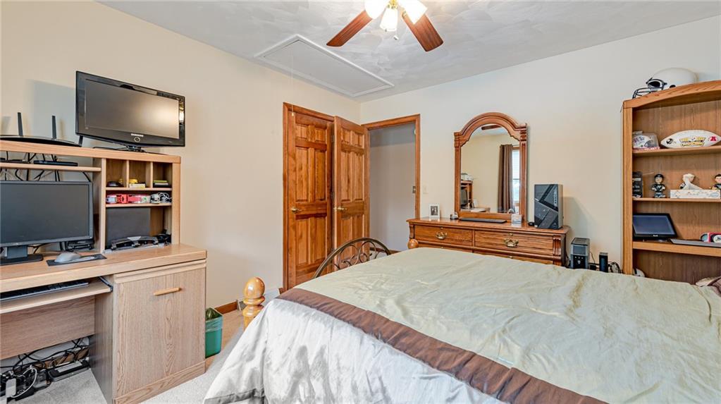 612 Rembrandt Circle Irwin, PA 15642 - Photo 24 of 32 a bedroom with a bed and a flat screen tv