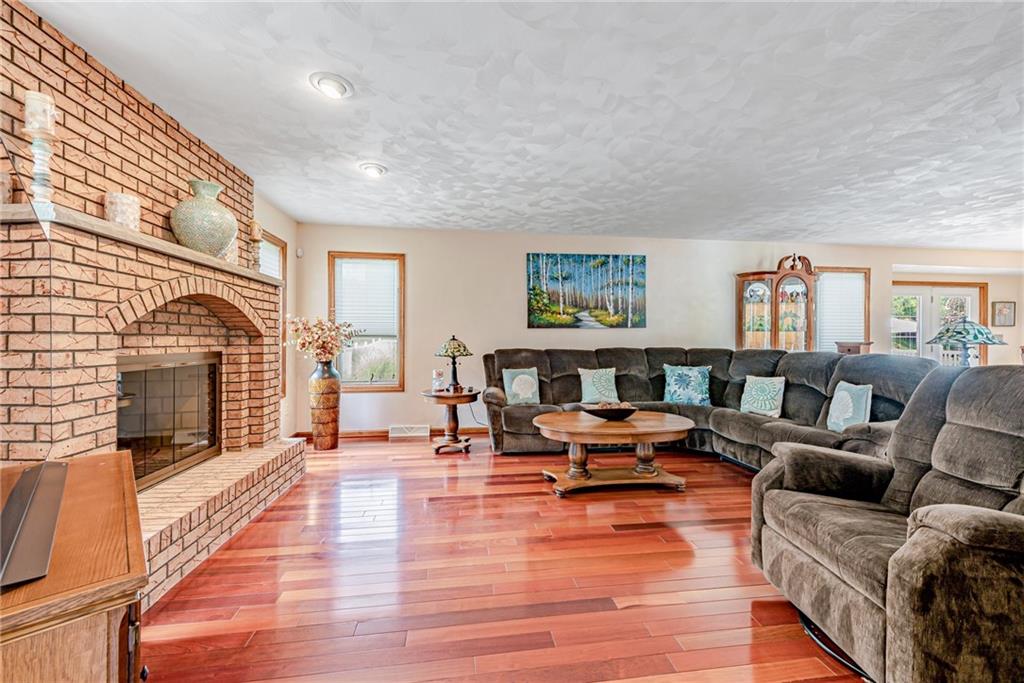 612 Rembrandt Circle Irwin, PA 15642 - Photo 5 of 32 a living room with furniture large window and wooden floor