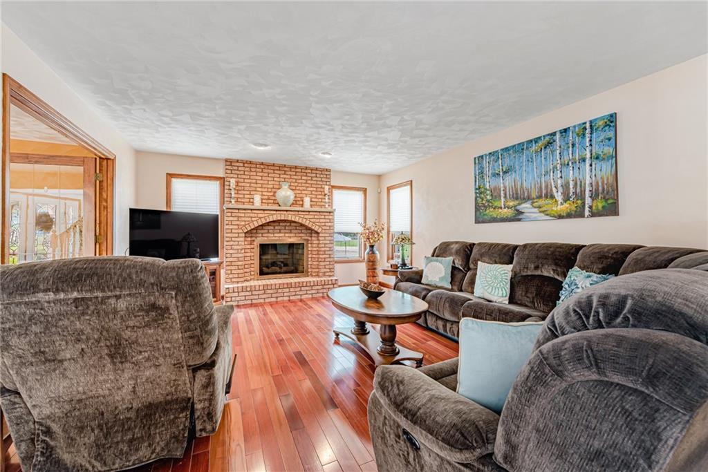 612 Rembrandt Circle Irwin, PA 15642 - Photo 6 of 32 a living room with furniture and a fireplace