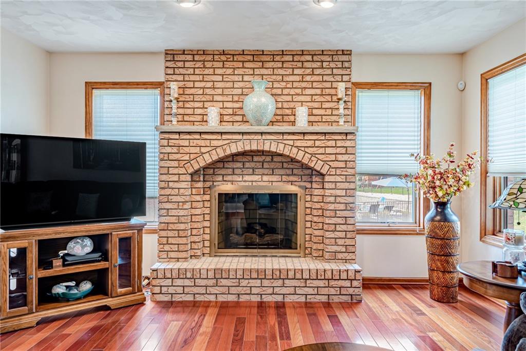 612 Rembrandt Circle Irwin, PA 15642 - Photo 7 of 32 a living room with furniture and a fireplace