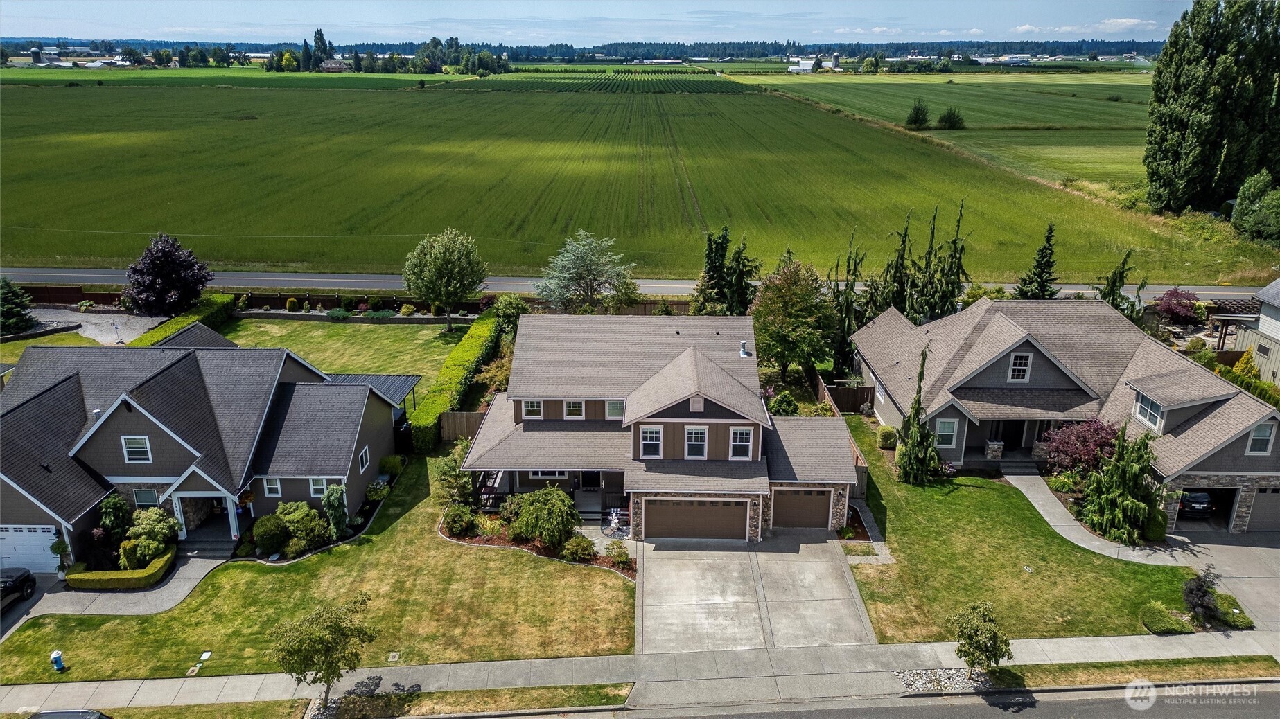 1877 Emerald Way Lynden, WA 98264 - Photo 32 of 33 an aerial view of houses with outdoor space and swimming pool
