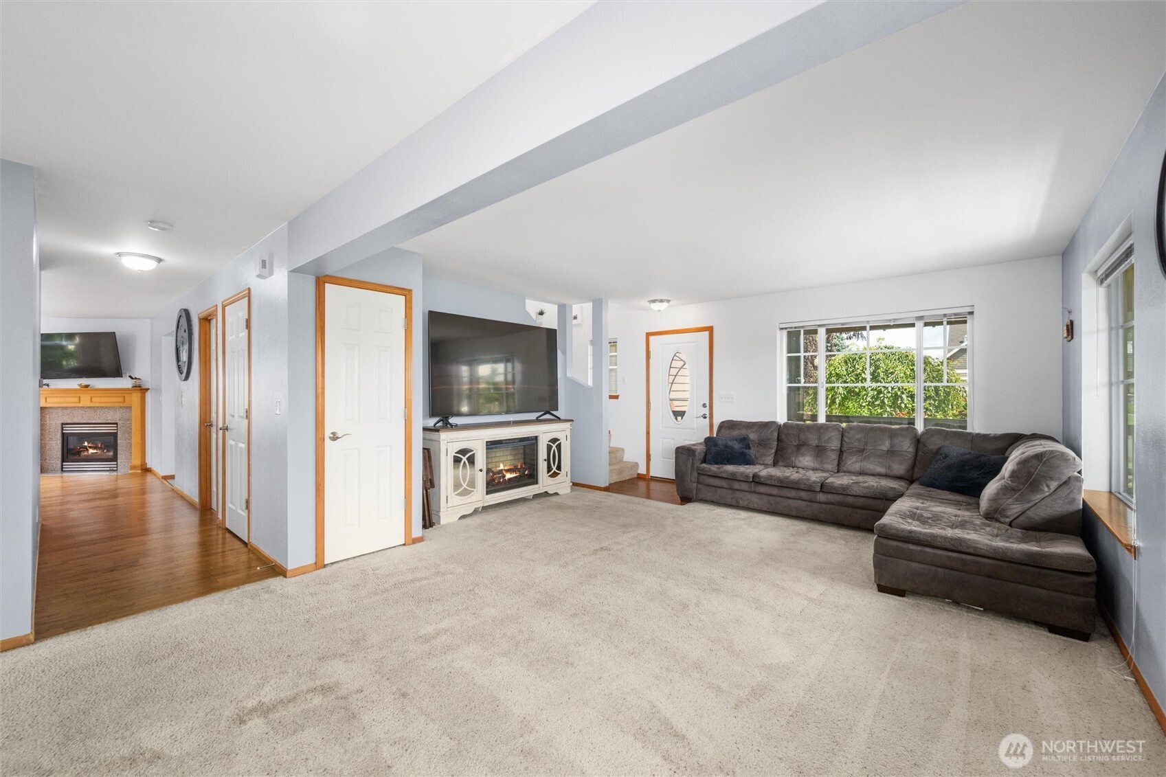 1877 Emerald Way Lynden, WA 98264 - Photo 7 of 33 a living room with furniture and a flat screen tv