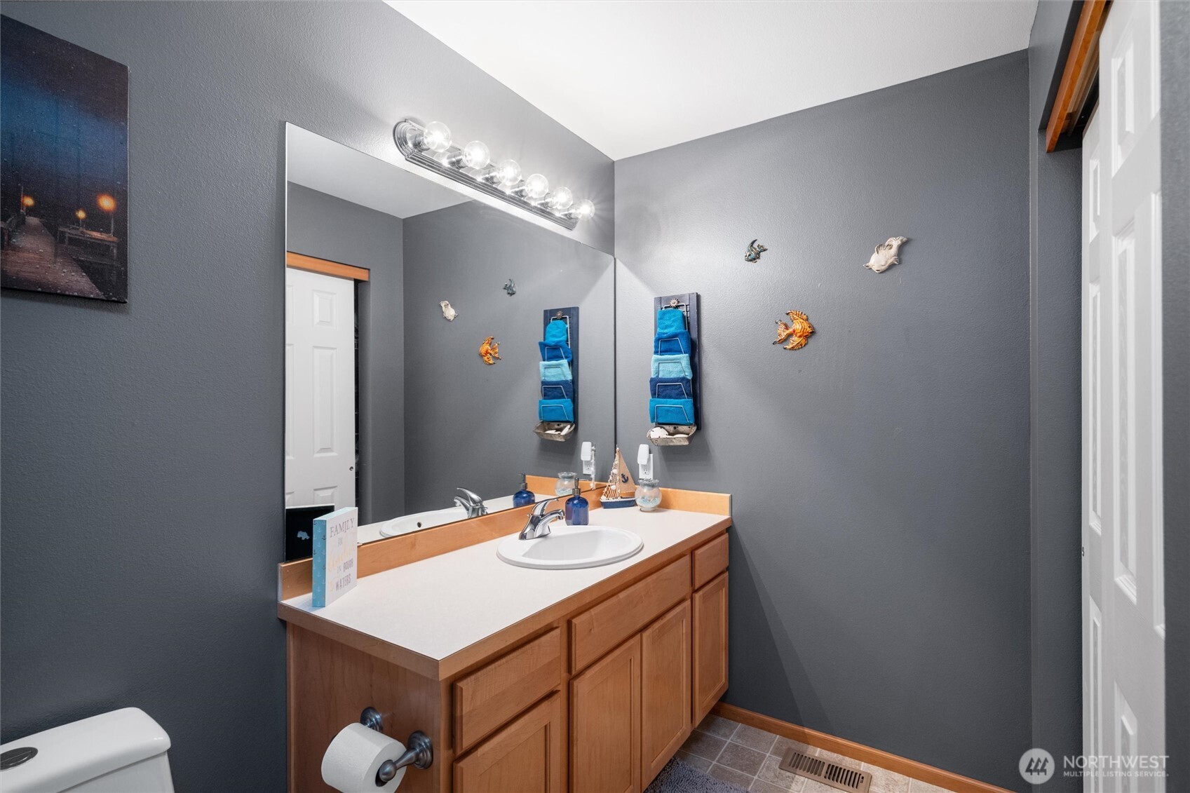 1877 Emerald Way Lynden, WA 98264 - Photo 8 of 33 a bathroom with a sink a toilet and a mirror