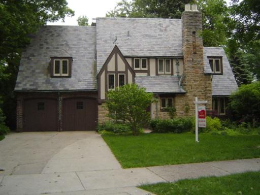 255 Bloomingbank Road Riverside, IL 60546 - Photo 1 of 1 a front view of a house with a garden and plants