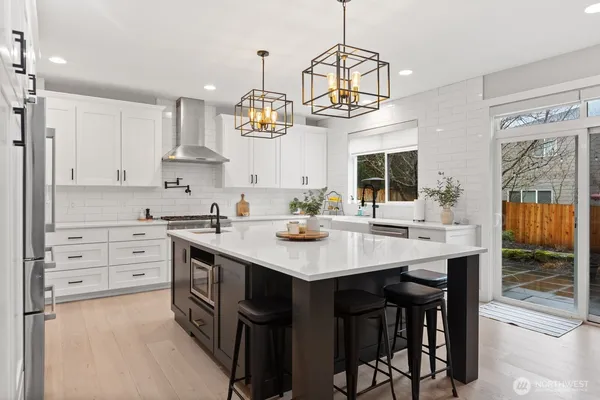 a kitchen with a center island and cabinets