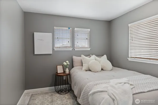 a bedroom with a bed and window