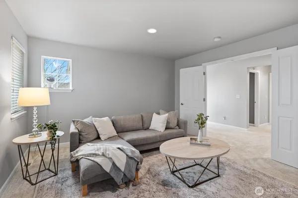 a living room with furniture and a table