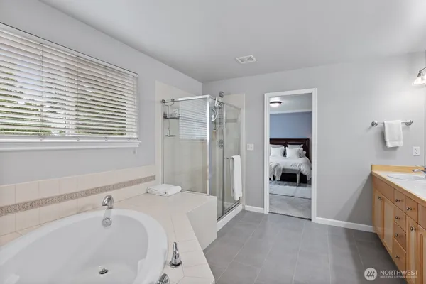 a bathroom with a bathtub and a sink