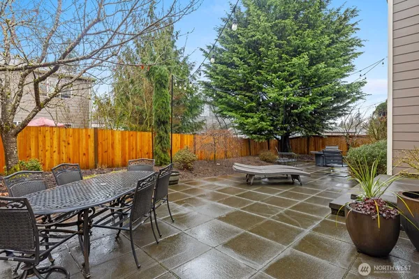 a view of a backyard with sitting area