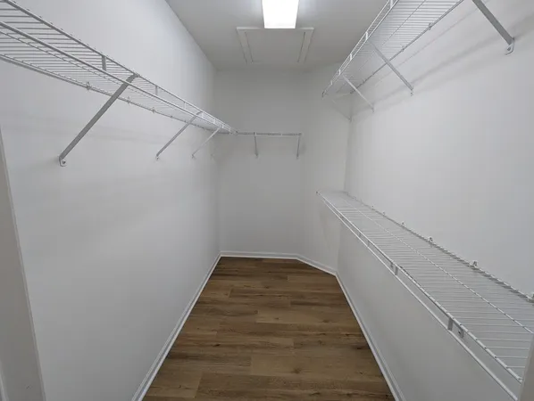 a view of a hallway with stairs