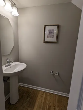 a bathroom with a sink mirror and vanity