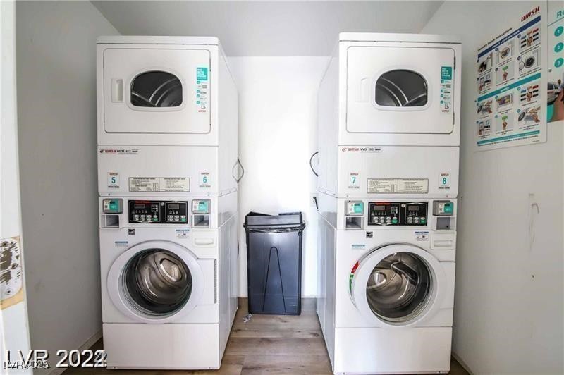 2201 Fairfield Avenue, Unit 13 Las Vegas, NV 89102 - Photo 5 of 5 Shared laundry room with estacked washer and dryer and wood finished floors