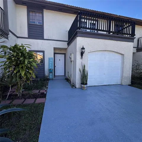 a view of a house with a small yard