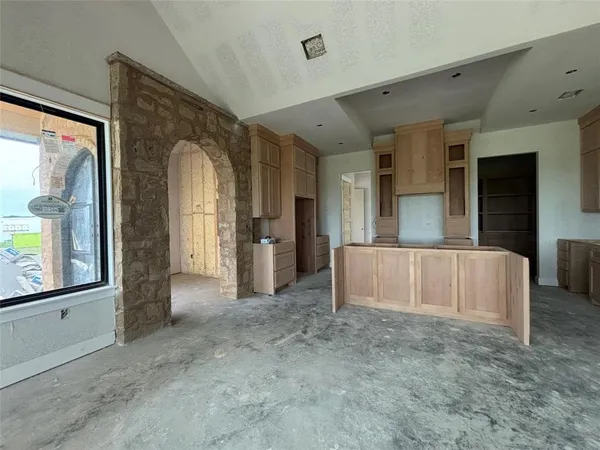 a view of a hallway with a kitchen