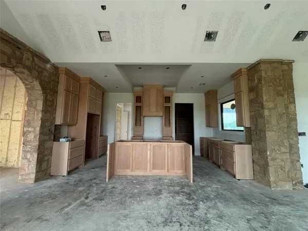 a kitchen with a sink and cabinets