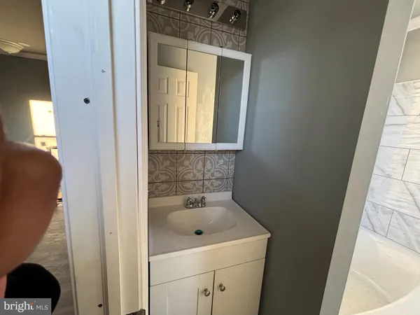 a bathroom with a sink and a vanity