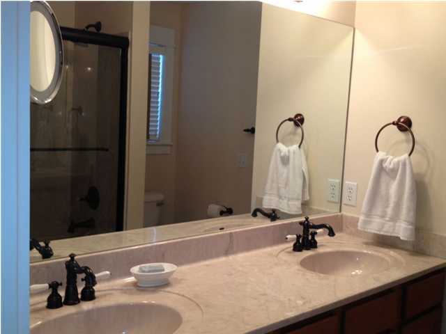 249 Beach Bike Way Seacrest, FL 32461 - Photo 17 of 24 a bathroom with a sink and a mirror