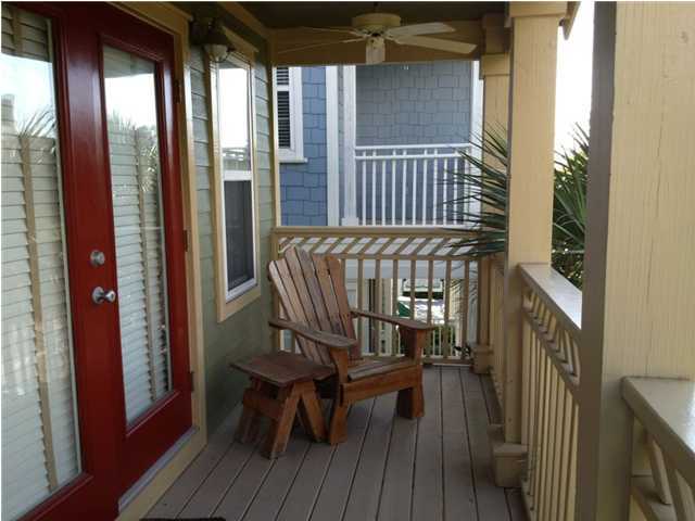 249 Beach Bike Way Seacrest, FL 32461 - Photo 18 of 24 a view of a balcony with furniture and wooden floor