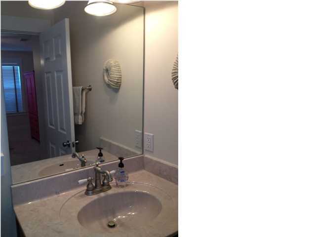 249 Beach Bike Way Seacrest, FL 32461 - Photo 21 of 24 a bathroom with a sink and a mirror