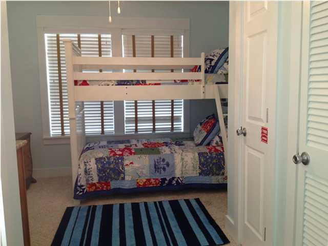 249 Beach Bike Way Seacrest, FL 32461 - Photo 22 of 24 a bed room with a bed and a window