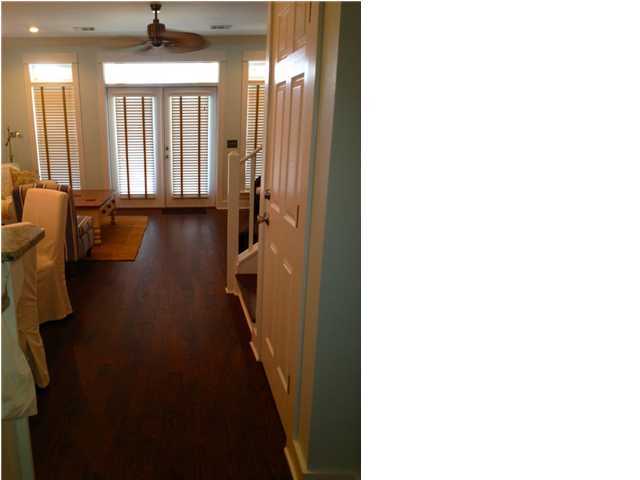 249 Beach Bike Way Seacrest, FL 32461 - Photo 7 of 24 a hallway with a large window and wooden floor